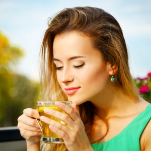Young Woman Drinking Green Tea Outdoors